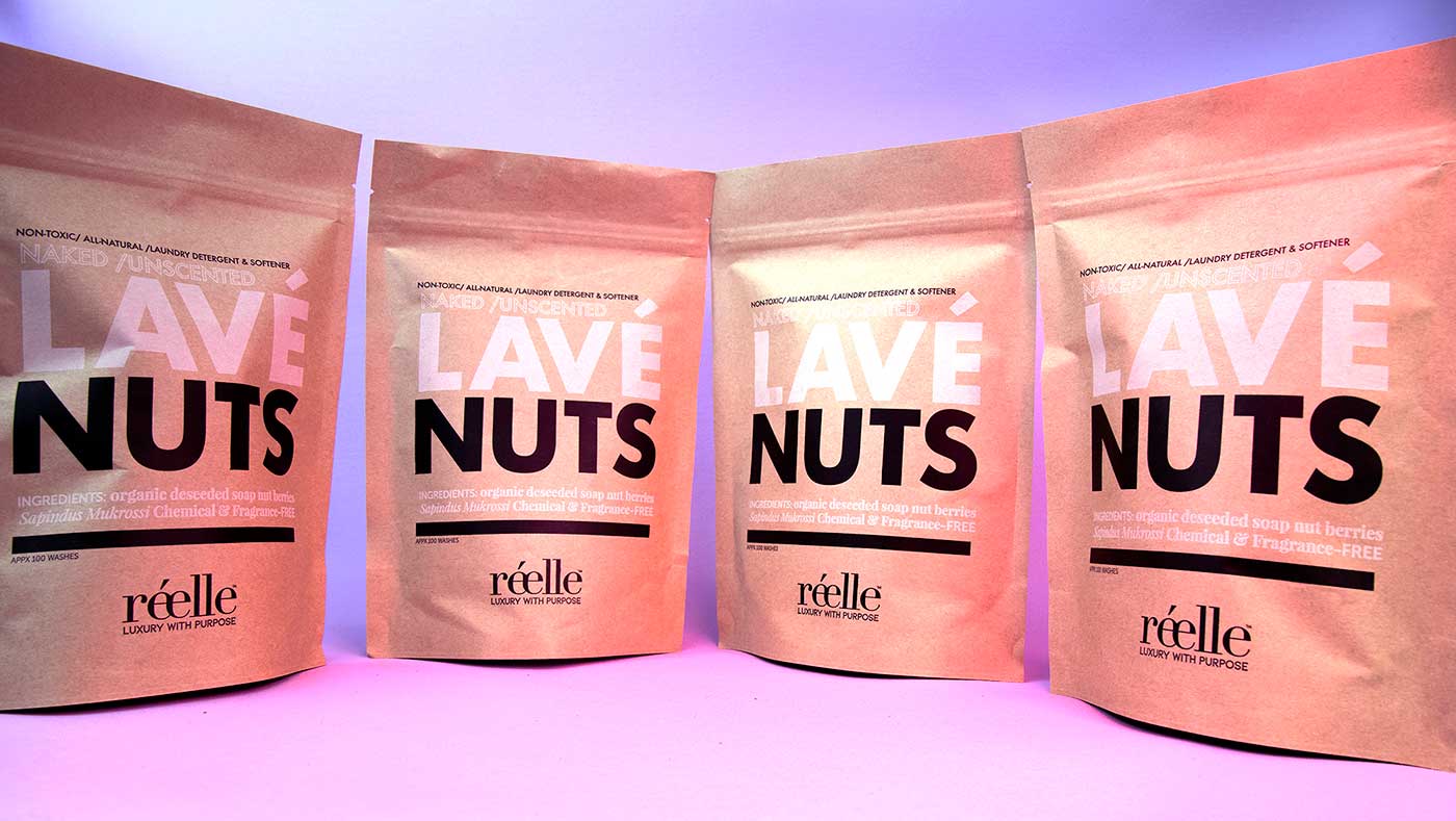 A Row of four Lave Nuts packages on display in their compostable packaging